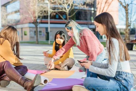 Multicultural group preparing together feminist movement womens international Stock Photos
