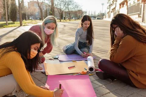 Multicultural group preparing together feminist movement womens international Stock Photos