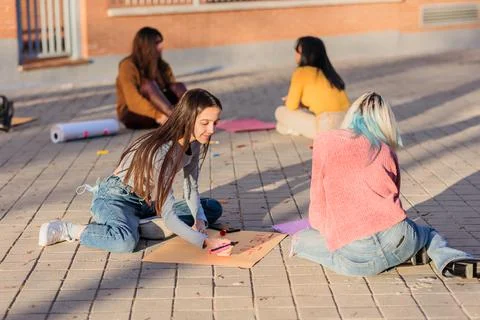 Multicultural group preparing together feminist movement womens international Stock Photos
