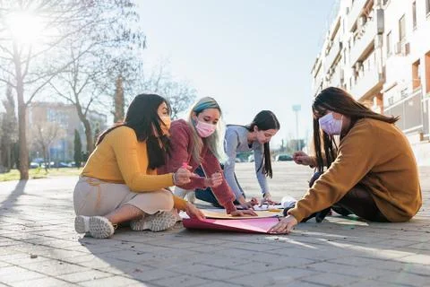 Multicultural group preparing together feminist movement womens international Stock Photos