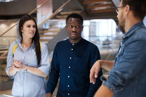 Multicultural group of students in a public library Stock Photos