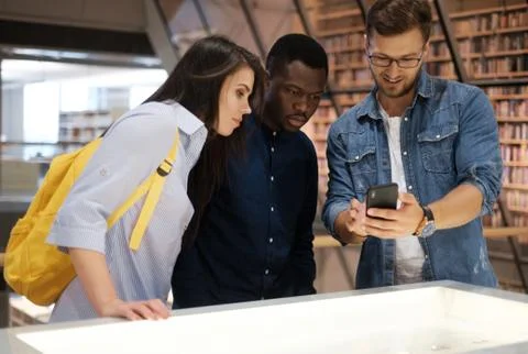 Multicultural group of students in a public library 스톡 사진