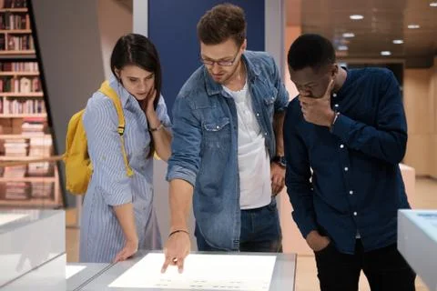 Multicultural group of students in a public library Foto stock