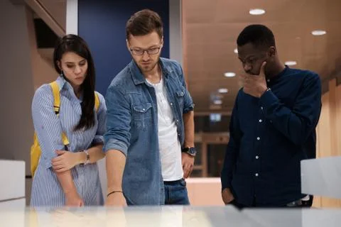 Multicultural group of students in a public library Foto stock