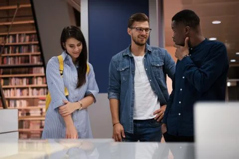 Multicultural group of students in a public library Fotos Stock