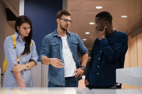 Multicultural group of students in a public library Foto stock