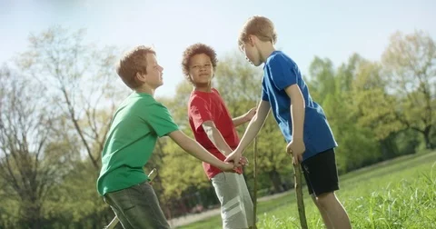 Multicultural kids group hands on top of each other outside Stock Footage 77612901