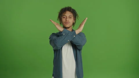 Multicultural Man Looking Straight to the Camera and Emotionally Making Cancel Video stock 219762656