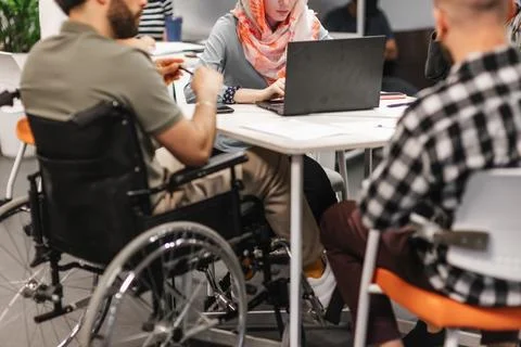 Multicultural people working in google environment at work. Woman in hijab Stock Photos