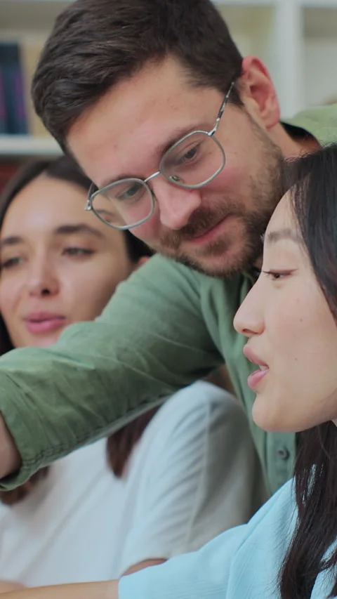 Multicultural students study for exams as a team, use computer Stock Footage 345148159