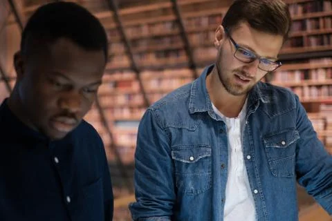 Multicultural stundets in a public library Photos