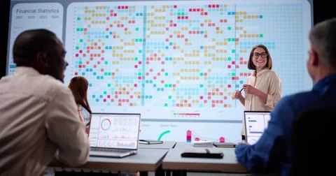 Multicultural Team Analyzing Financial Data On Touchscreen Stock Photos