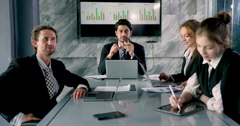 Multicultural team discussing new business ideas, businessman speaking while Stock Footage 328566209
