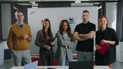Multicultural team of office employees. Five people are looking at the camera Stock Footage 232474885