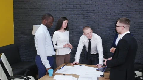 Multicultural team of professionals discussing project in office Stock Footage 95646785
