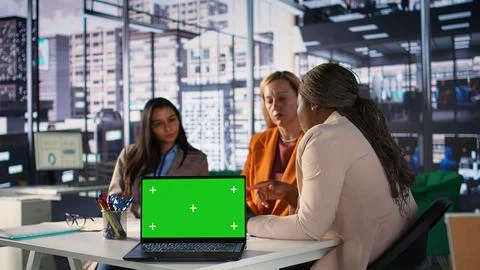Multicultural team of specialists using mockup copy space in the office Stock Photos