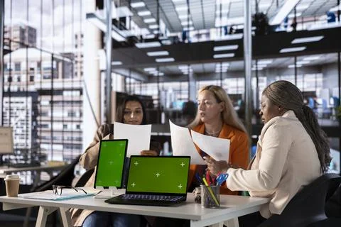 Multicultural team of specialists using mockup copy space in the office Stock Photos