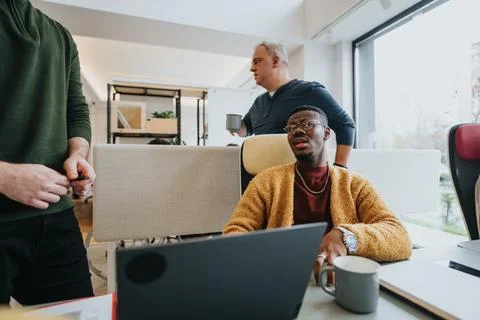 Multicultural team at work in modern office environment with professional team Stock Photos