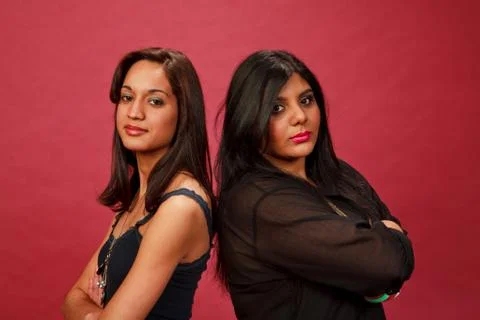 Multicultural women back to back upset Stock Photos