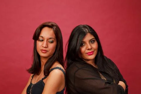 Multicultural women back to back upset Stock Photos
