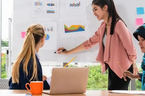 Multicultural working group in teamwork meeting. Stock Photos
