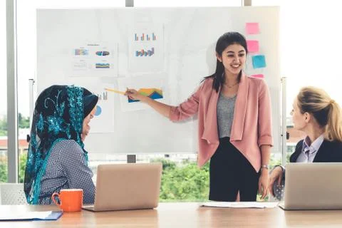 Multicultural working group in teamwork meeting. Stock Photos