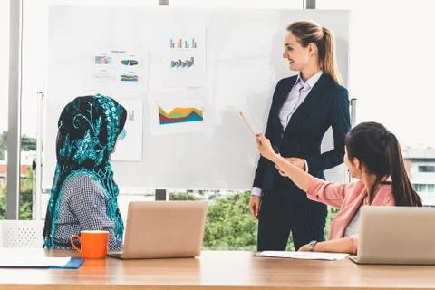 Multicultural working group in teamwork meeting. Stock Photos