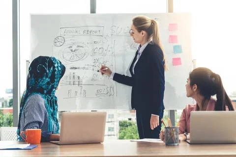 Multicultural working group in teamwork meeting. Stock Photos