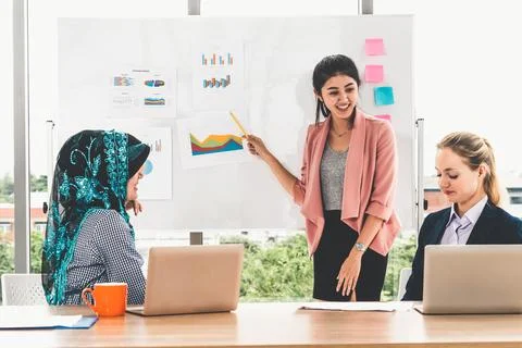 Multicultural working group in teamwork meeting. Stock Photos