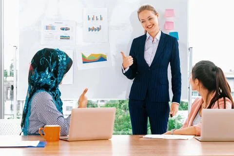 Multicultural working group in teamwork meeting. uds Stock Photos