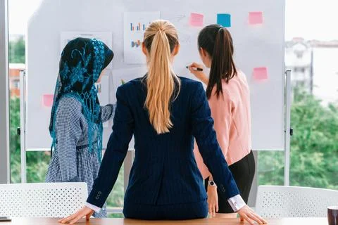 Multicultural working group in teamwork meeting. uds Stock Photos