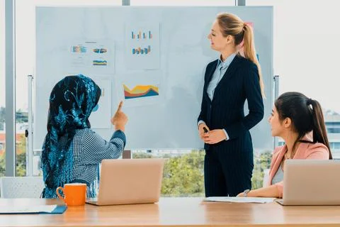 Multicultural working group in teamwork meeting. uds Stock Photos