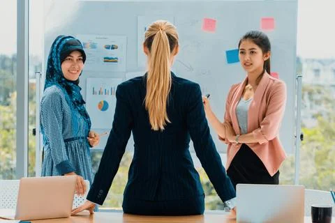 Multicultural working group in teamwork meeting. uds Stock Photos