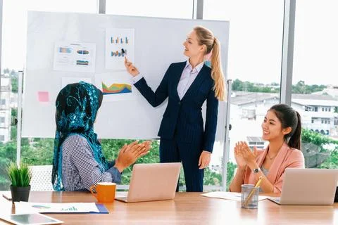 Multicultural working group in teamwork meeting. uds Stock Photos
