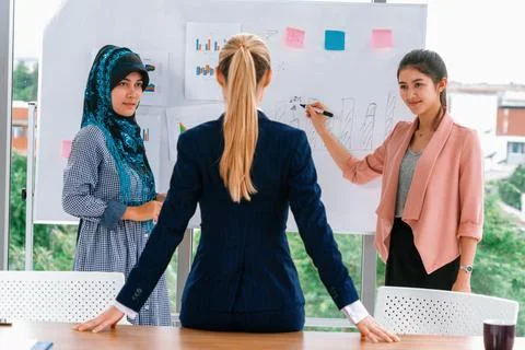Multicultural working group in teamwork meeting. uds Stock Photos
