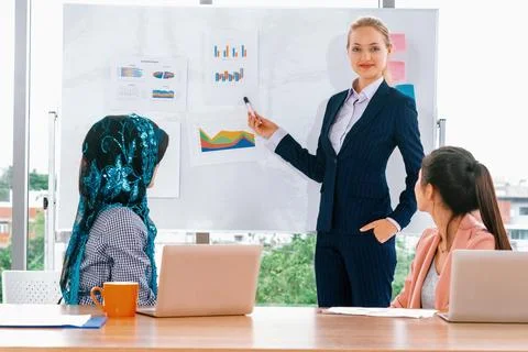 Multicultural working group in teamwork meeting. uds Stock Photos