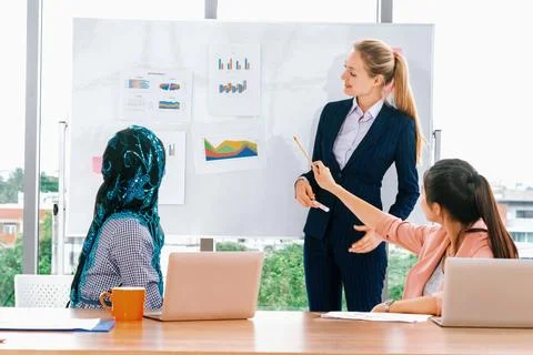 Multicultural working group in teamwork meeting. uds Stock Photos