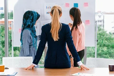 Multicultural working group in teamwork meeting. uds Stock Photos