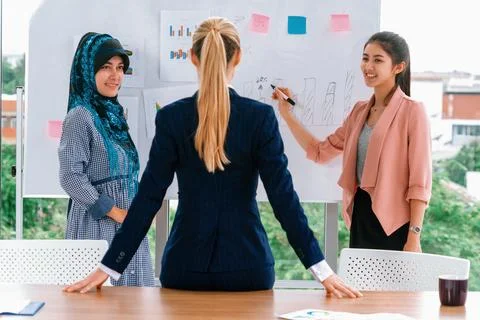 Multicultural working group in teamwork meeting. uds Stock Photos