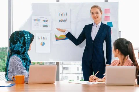 Multicultural working group in teamwork meeting. uds Stock Photos