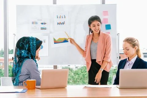 Multicultural working group in teamwork meeting. uds Stock Photos
