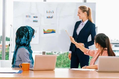 Multicultural working group in teamwork meeting. uds Stock Photos