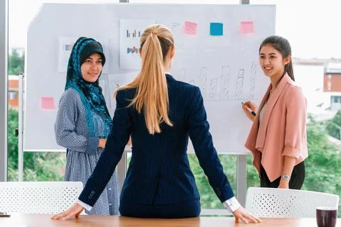 Multicultural working group in teamwork meeting. uds Stock Photos
