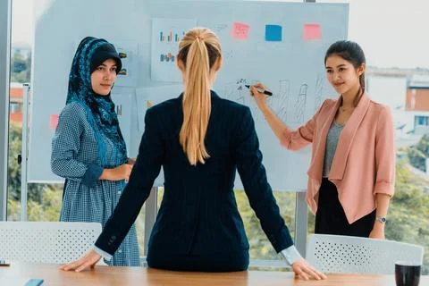 Multicultural working group in teamwork meeting. uds Stock Photos