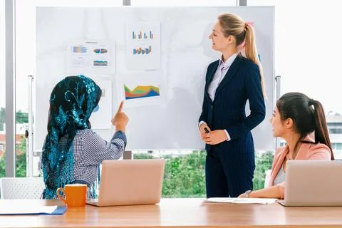 Multicultural working group in teamwork meeting. uds Stock Photos