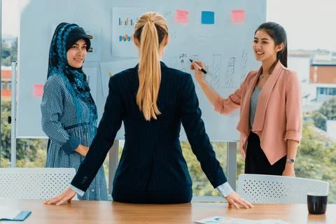Multicultural working group in teamwork meeting. uds Stock Photos