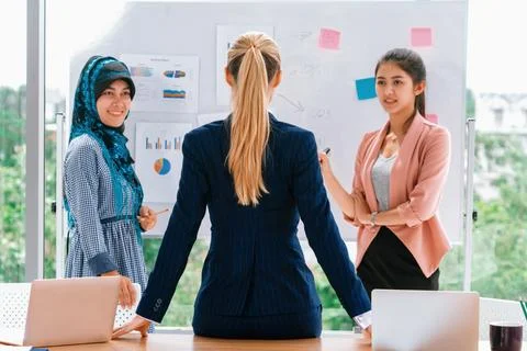 Multicultural working group in teamwork meeting. uds Stock Photos