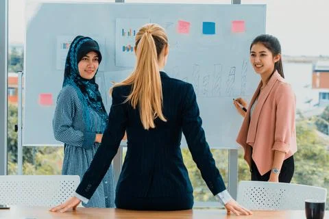 Multicultural working group in teamwork meeting. uds Stock Photos