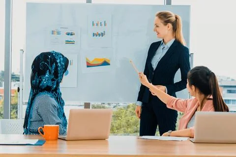 Multicultural working group in teamwork meeting. uds Stock Photos