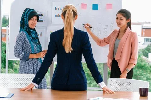 Multicultural working group in teamwork meeting. uds Stock Photos